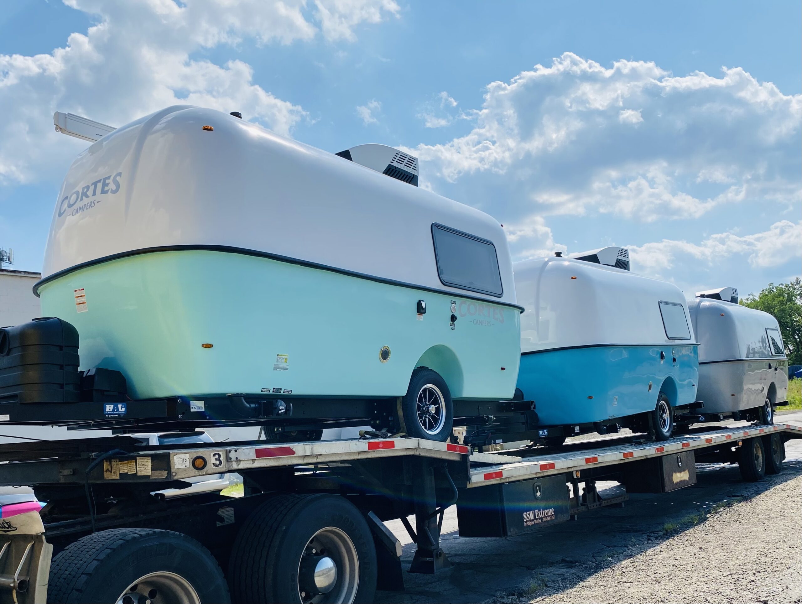 Cortes Campers triple load headed to a Cortes Campers Dealer in Canada.